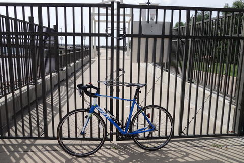 Bike in front of a locked gate