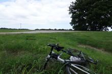 Taking a short break in a field with the bike. 