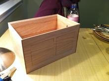 The box, less top and sides. 
